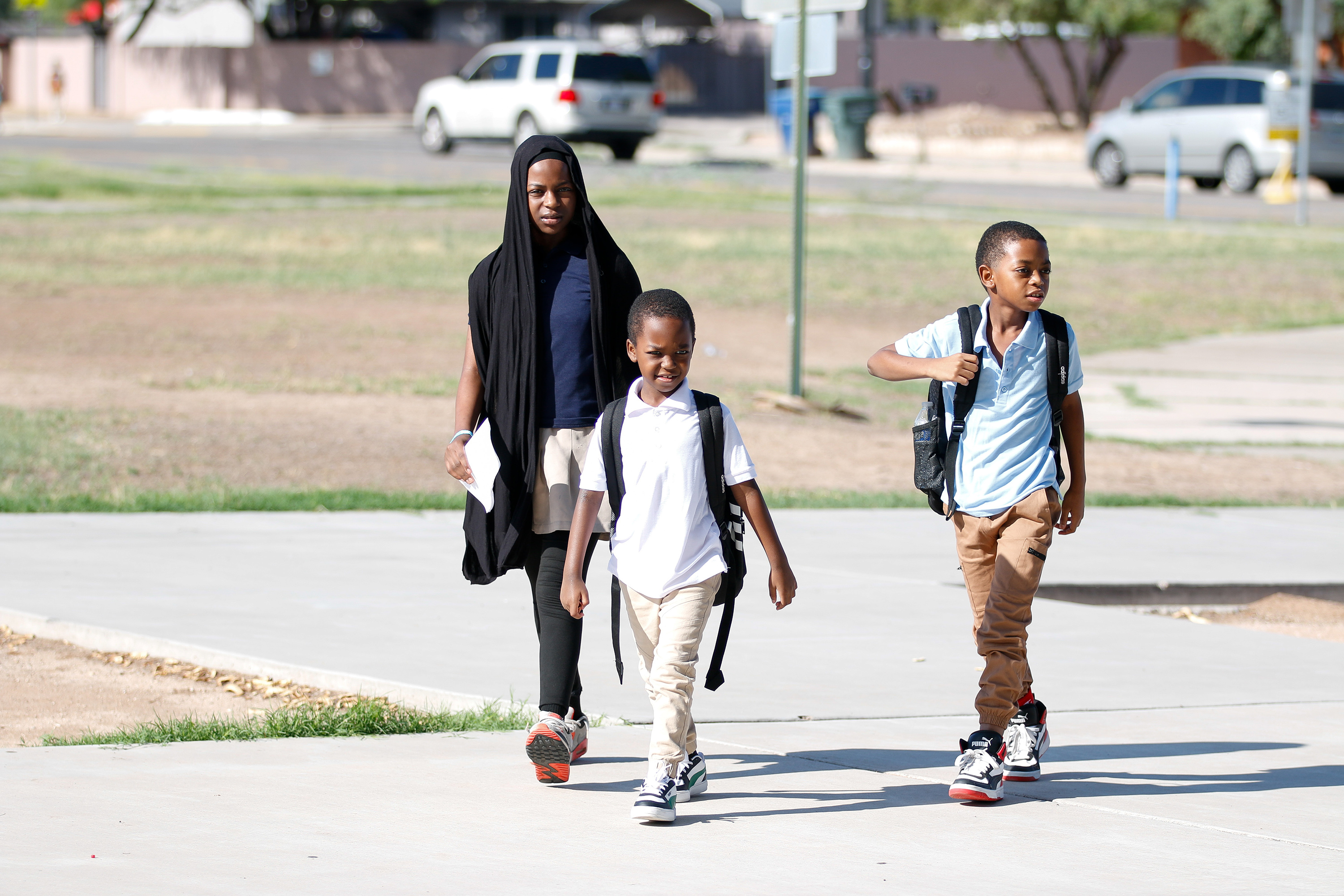 Three students walk to school on the secondday