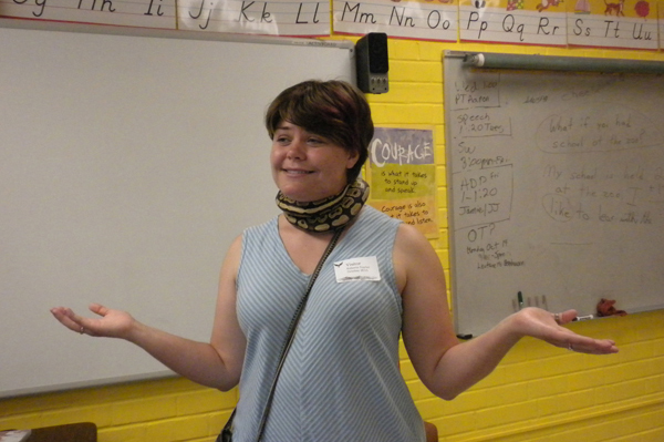Snake wrapped around teachers neck while she laughs