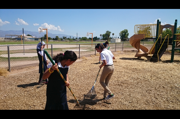 Students cleaning playground 