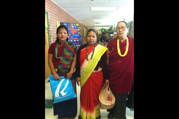 Student with parents dressed in traditional heritage clothes