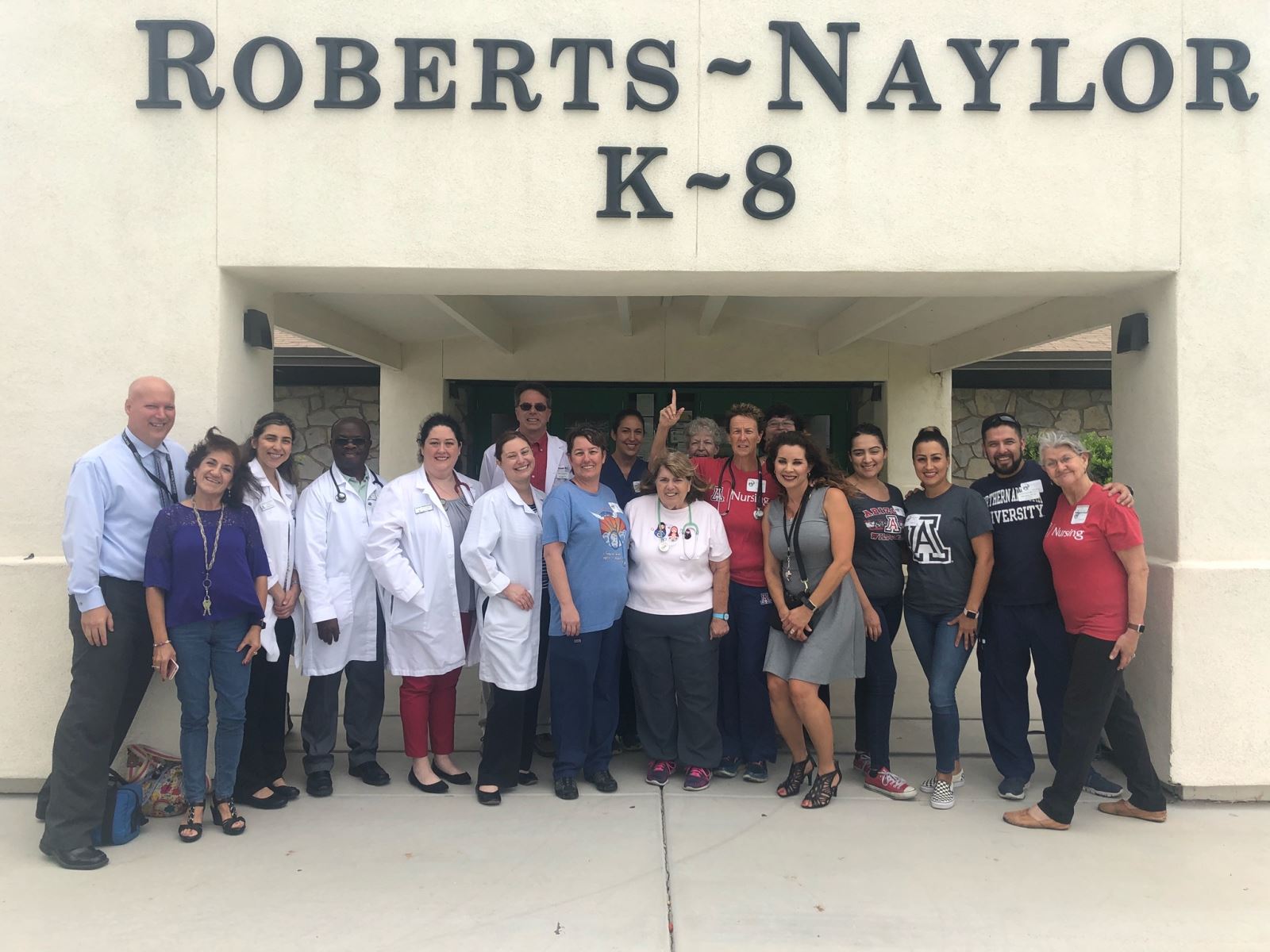 Staff and Physicians outside of Roberts Naylor School